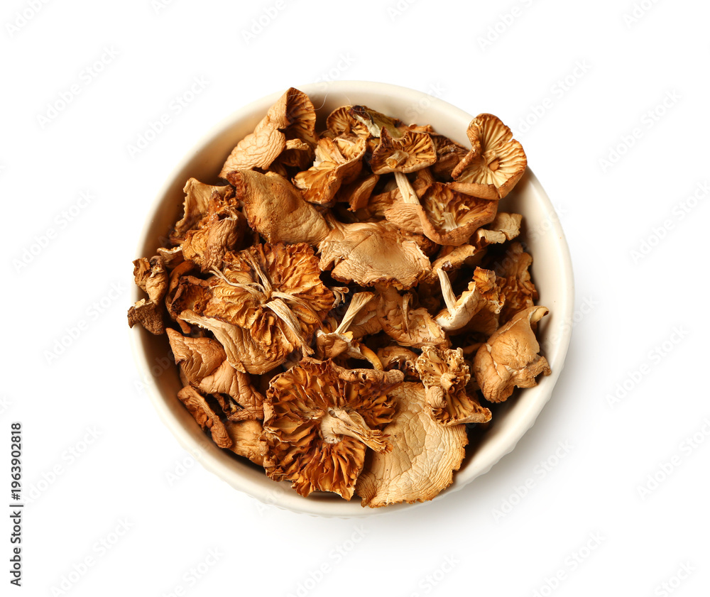 Obraz premium Bowl with dried mushrooms on white background