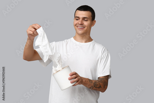 Ill young man with tissues ...