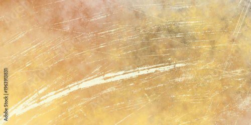 Distressed grunge texture with scratched surface in warm ochre and brown tones