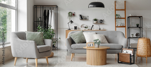 Bild auf Leinwand Interior of light living room with grey sofa, armchair and wooden coffee table