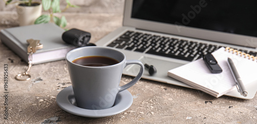 Cup of coffee, laptop and n...