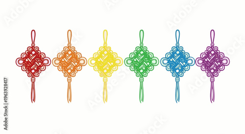A row of six colorful, intricately knotted decorative ornaments hang against a white background