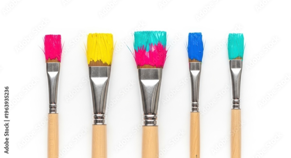 Fototapeta premium Five paint brushes with colorful bristles on white background