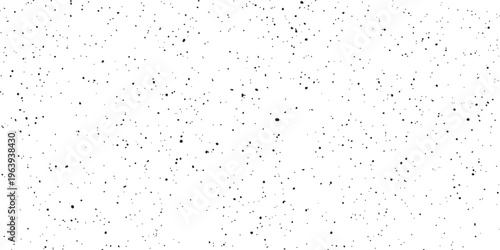 Tableau sur toile Black ink splatter texture with small irregular dots on a white background