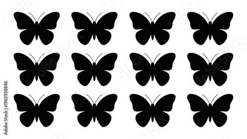 A collection of twelve symmetrical black butterflies arranged in a grid pattern