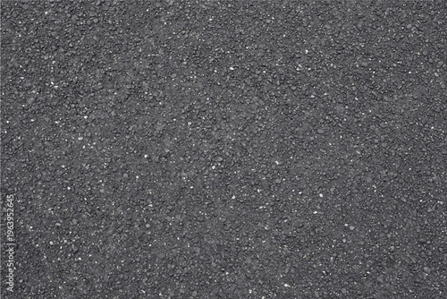 Dark gray asphalt texture with small granular stones and pebbles