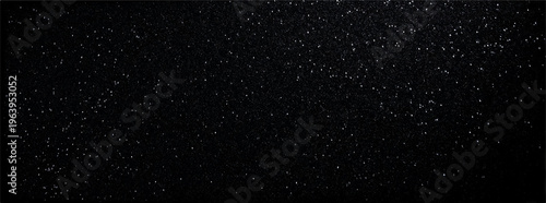 Night sky filled with scattered white stars and distant cosmic dust particles