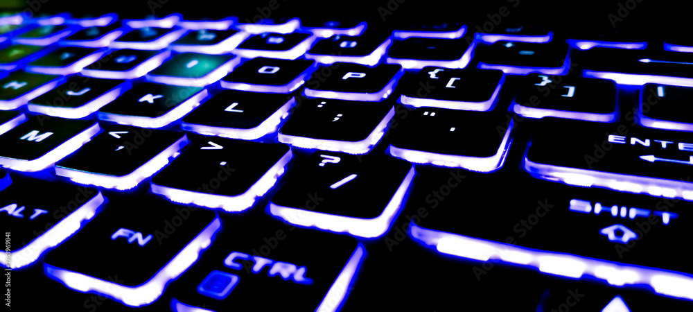 Fototapeta premium computer keyboard with blue button