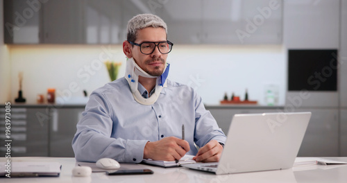 Injured Worker Documenting Accident Report On Laptop
