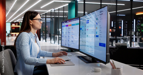Photos Manager Evaluates Payroll System Updates On Desktop