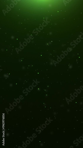 Vertical green glowing particles rising on black background with top light flare, 9:16 smartphone video, Full HD