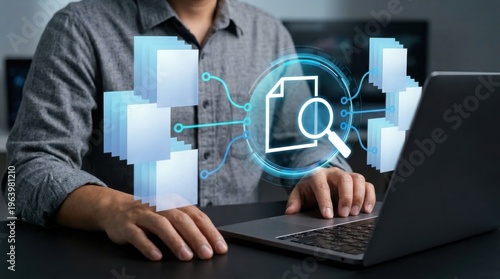 Person using laptop with digital interface displaying document search and data layers