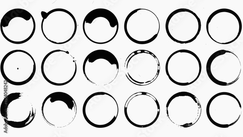 black coffee stain rings and ink marks creating grunge texture on white background ideal for abstract design and graphic elements.