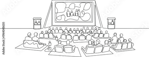 people sitting on floor watching movie screen