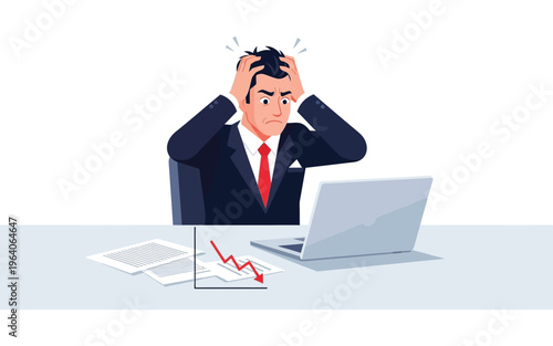 Worried businessman clutching head at laptop with falling chart.