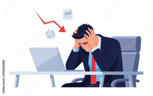 Stressed businessman holding head at laptop.