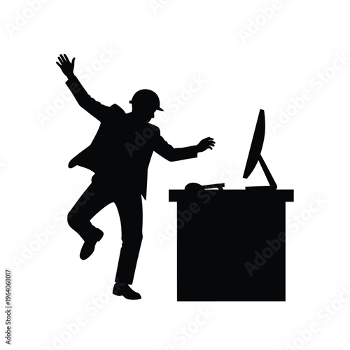 Silhouette of a man falling near a desk with a computer.