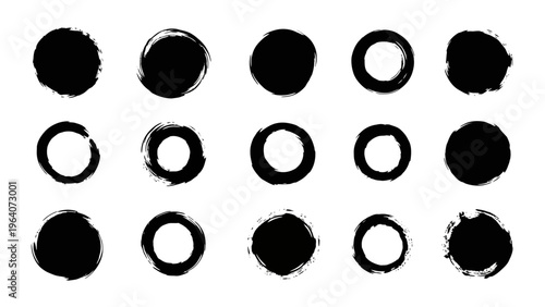 hand drawn black ink brush stroke circles and enso rings set providing grunge and abstract design elements for creative graphic art