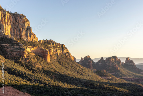Forested rugged rock formations in sedona landscape