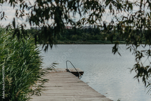 Summer landscape. Bridge on the river.