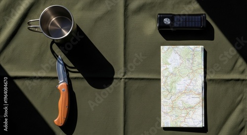 Outdoor camping gear on fabric.