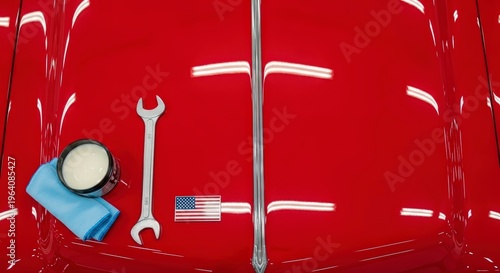 American car maintenance tools on hood.