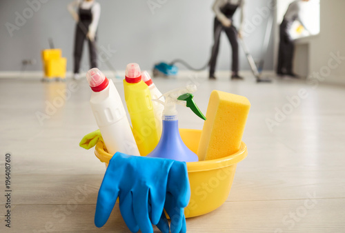 Photos Cleaners team doing cleaning with bucket supplies