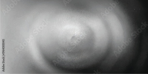 Close up black and white macro of human skin texture showing a nipple and areola with soft lighting and smooth gradients