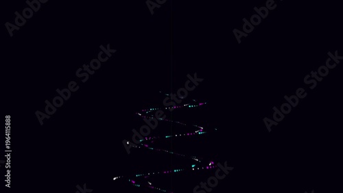 4k display of colorful lights forming a tree shape appears in the dark.