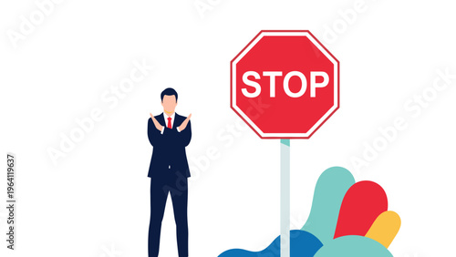 Professional man in a dark suit holding his arms in an x shape next to a red stop sign to represent a warning or halt.