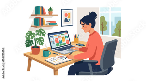 Young woman working diligently on her laptop at a desk.