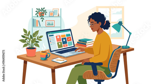 Young woman working diligently on her laptop at a desk.