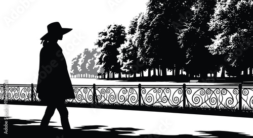 Woman walking along a path in a park dark silhouette