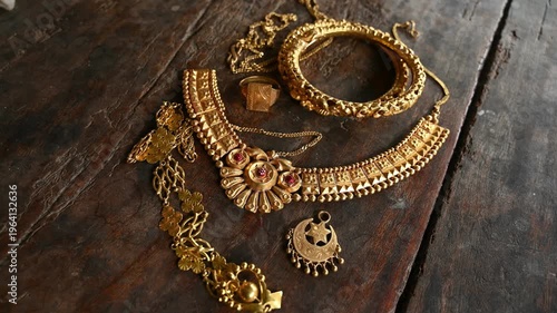 Gold prices in India are significant as an economic indicator and cultural cornerstone. As the largest consumer, the rising prices of old, vintage, expensive Indian-style gold jewelry. shiny necklace.