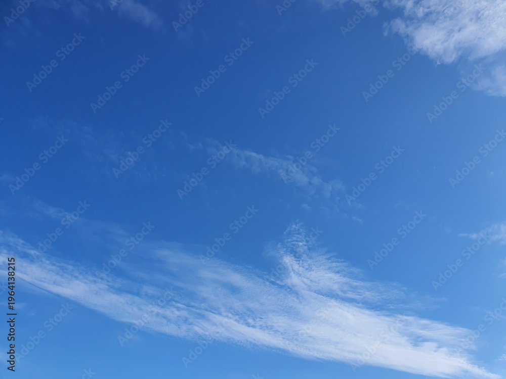 Fototapeta premium Clear blue sky with soft clouds, summer weather background, copy space