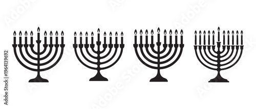 Four black silhouettes of traditional jewish hanukkah menorahs with lit candles on a white background.