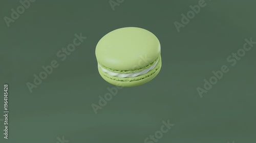Elegant Green Macaron Cookie with White Filling on a Dark Green Background