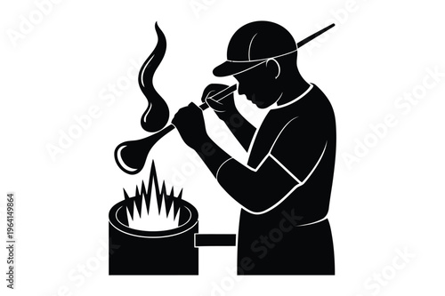 Glassblower working with molten glass silhouette with black and white