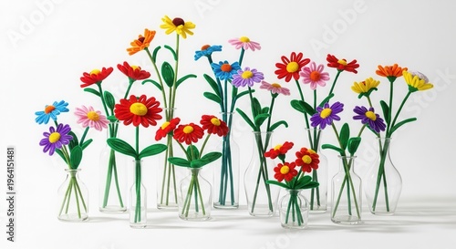 Colorful Pipe Cleaner Flowers in Glass Vases on White Background.