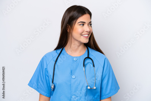 Young Brazilian nurse woman isolated on white background looking side