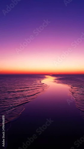 Breathtaking Vibrant Sunset Over Calm Ocean Waters with Warm Golden Pink Purple Hues Reflecting on Sea Surface Serene Nature Landscape Vertical Cinematic Footage for Travel