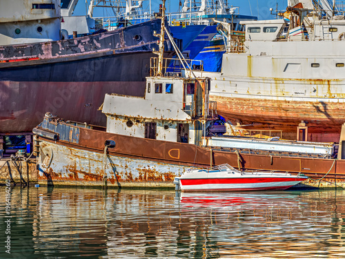 Rusty boats and fishing vessels in Mazara del Vallo harbor