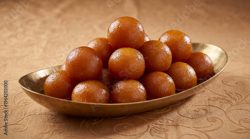 Fotografie A bowl of delicious gulab jamun, a popular indian sweet dessert, served in a bra