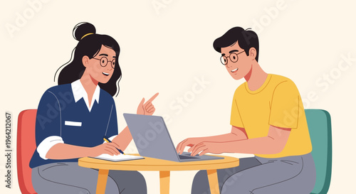 Two young adults collaborating on laptop at small table with notebook