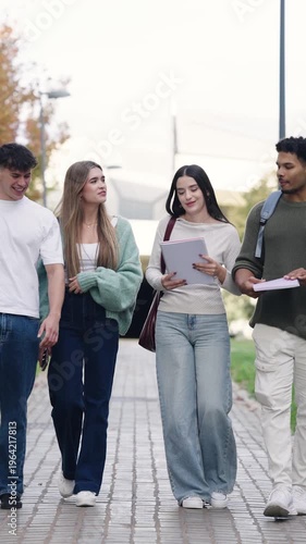 Group of smiling multinational college students walking on campus after class. Young friends enjoying university life and friendship. Vertical