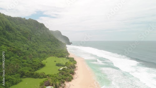 4K drone footage of Uluwatu, Bali: dramatic cliffs, crashing waves and turquoise ocean under bright daylight. Perfect for travel, nature, adventure and tropical destination projects