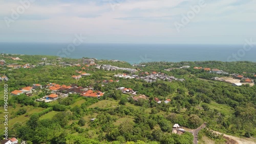 4K drone footage of Uluwatu, Bali: dramatic cliffs, crashing waves and turquoise ocean under bright daylight. Perfect for travel, nature, adventure and tropical destination projects