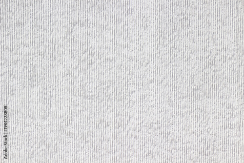 The background is white with small raised stripes.