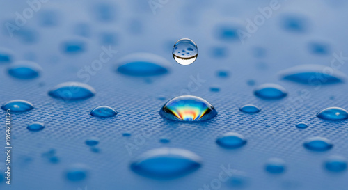 Water droplets on blue surface with reflections and details  