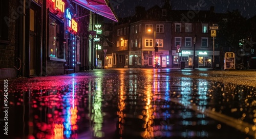 Brightly colored neon reflections shimmer on a wet city street during a nighttime downpour